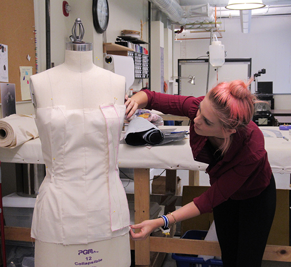 Madison Hendricks working on garment.