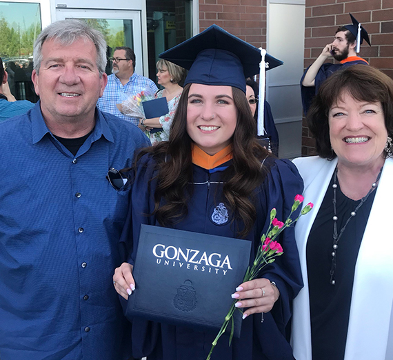 Melissa Keenan on her graduation day with parents 