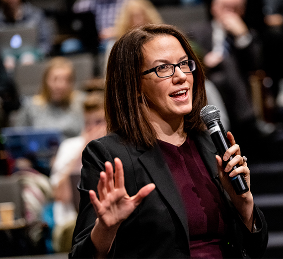 Christine Uri speaks to students at Wolff Auditorium