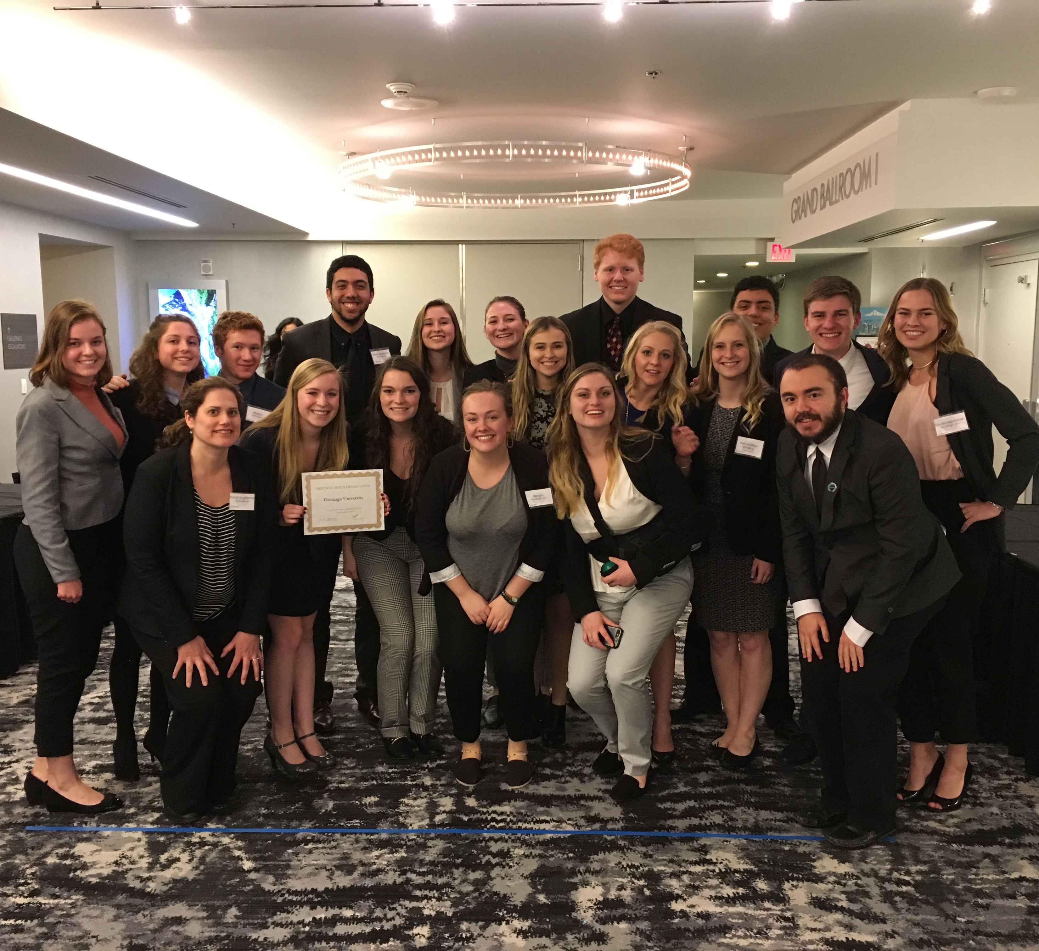 Model United Nations students holding up placards with country names.