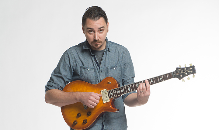 male musician with guitar