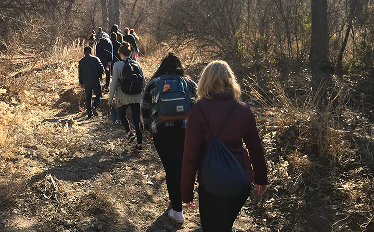 Students walk through the wilderness near the U.S./Mexico border