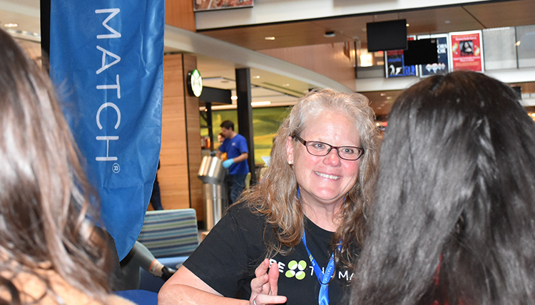 toni fairhurst visits with students at Hemmingson Center