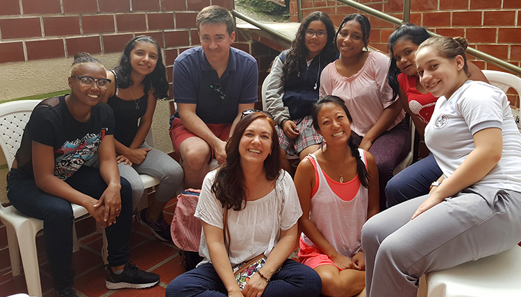 Linda Hobrock with students in Colombia