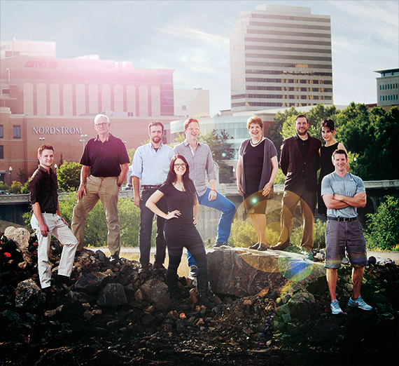 Group photo of community builders near the Spokane River