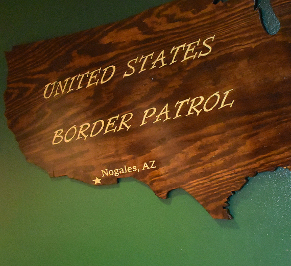 wooden us map with the Nogalez AZ border office marked 