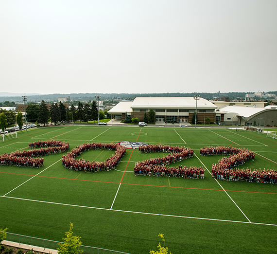 The Class of 2022 forms on Mulligan Field. GU photo 