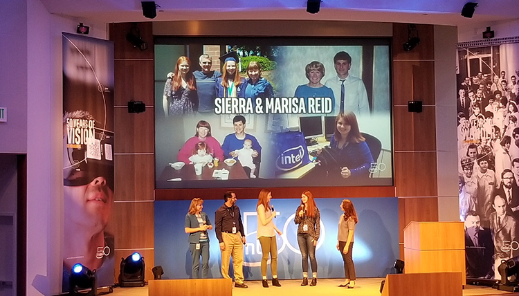 The Reid sisters are center stage holding microphones during Intel's 50th anniversary celebration in July. Marisa (left) faces Sierra. Their presentation was live-streamed to the company's 100,000-plus employees. (Photo courtesy Sierra Reid) 
