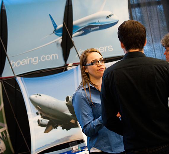 Student talking with Boeing at the Engineering & Computer Science Career and Internship Fair