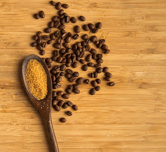 Wooden spoon with coffee and sugar