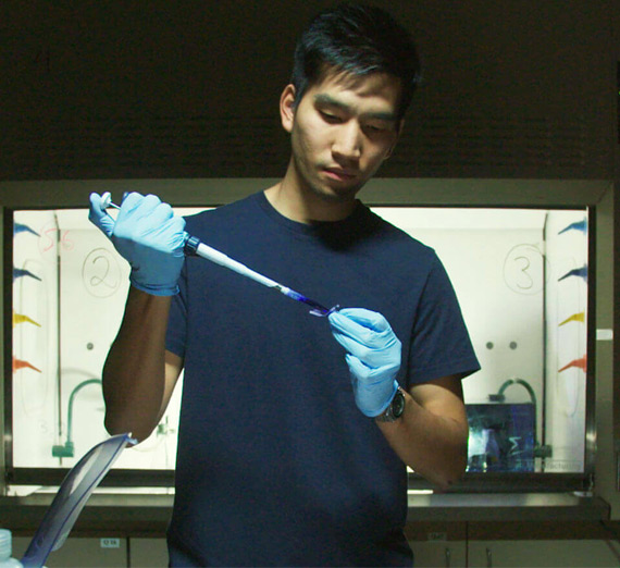 Sarin "Putter" Tiatragul working in lab. 