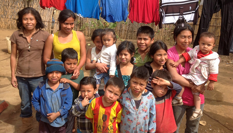 Guatemalan women and children gather for a photo