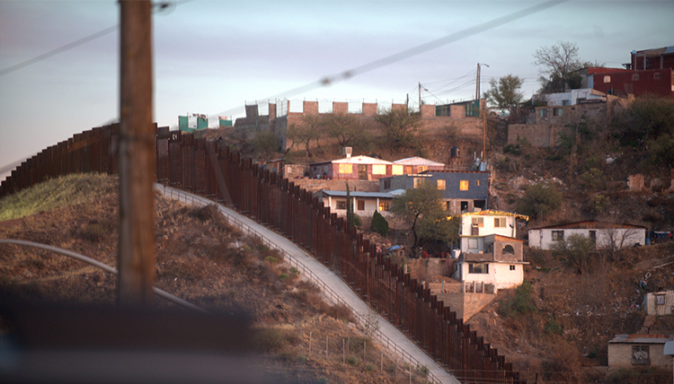 the steel wall diving the town of Nogales across the U.S.-Mexico border