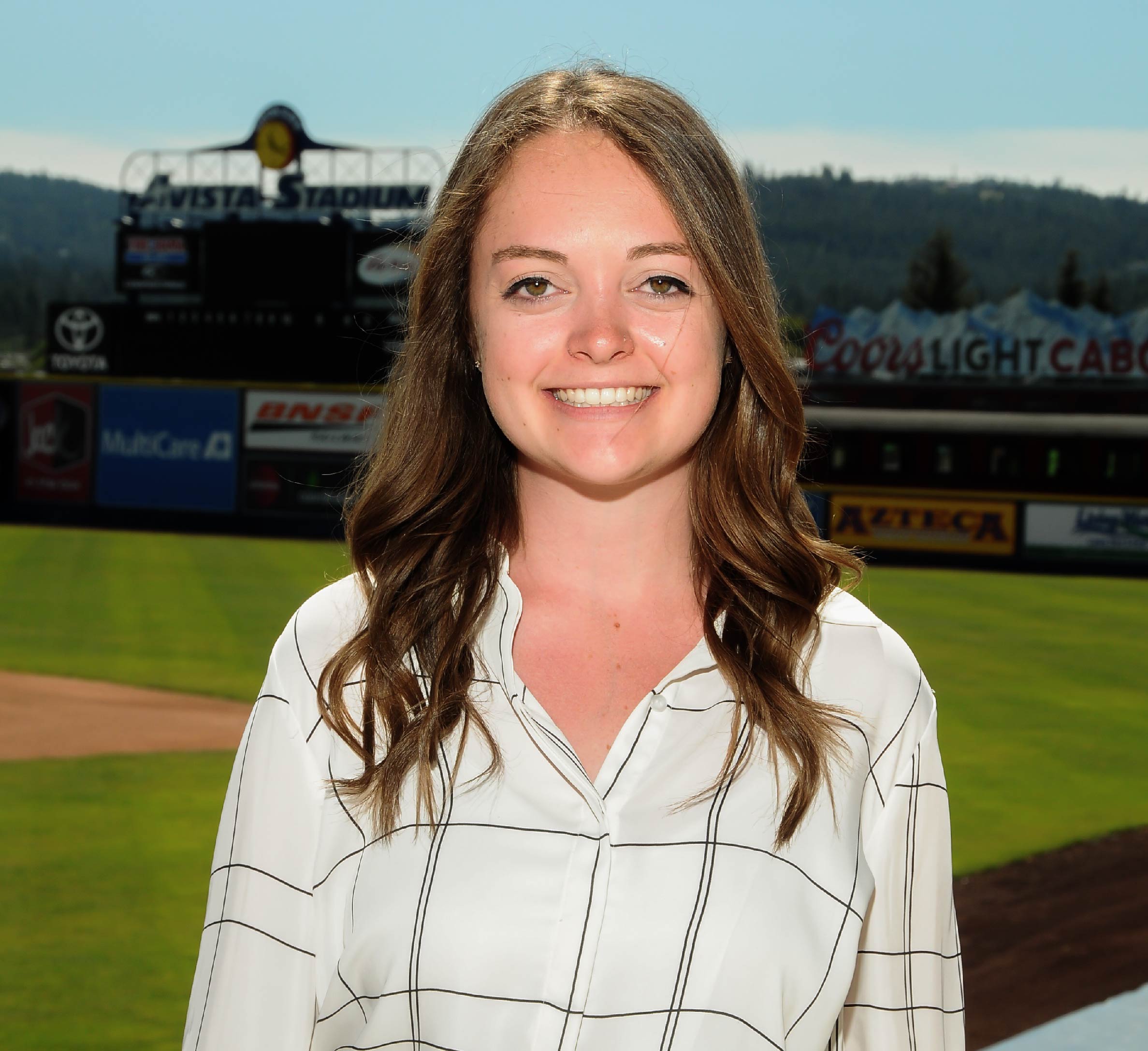 Rebecca Collins '19 headshot from internship with the Spokane Indians