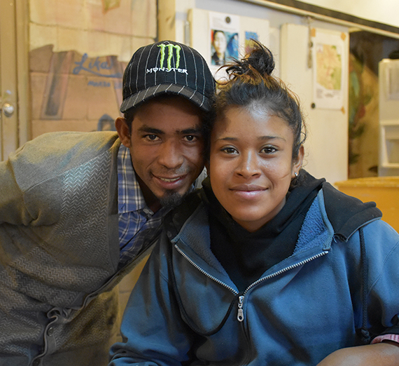 Central American couple posing at a humanitarian agency after deportaiton