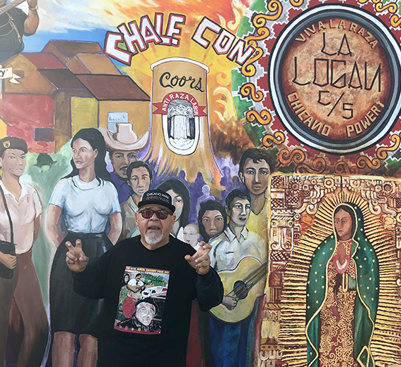 students paint a wall at Friendship Park in Tijuana