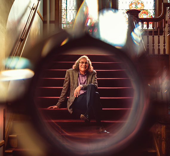 Raymond Reyes on the steps of GU College Hall