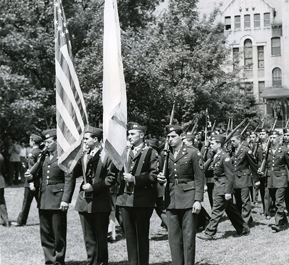 ROTC members presenting colors in uniform