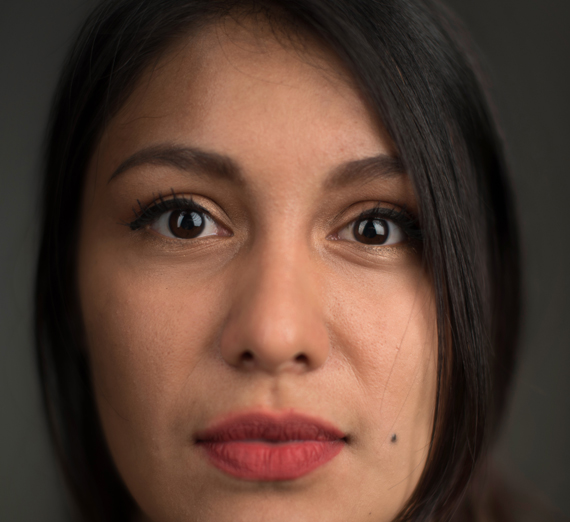 Profile of straightfaced Hispanic woman