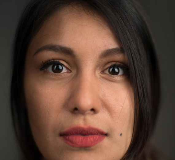 Profile of straightfaced Hispanic woman 