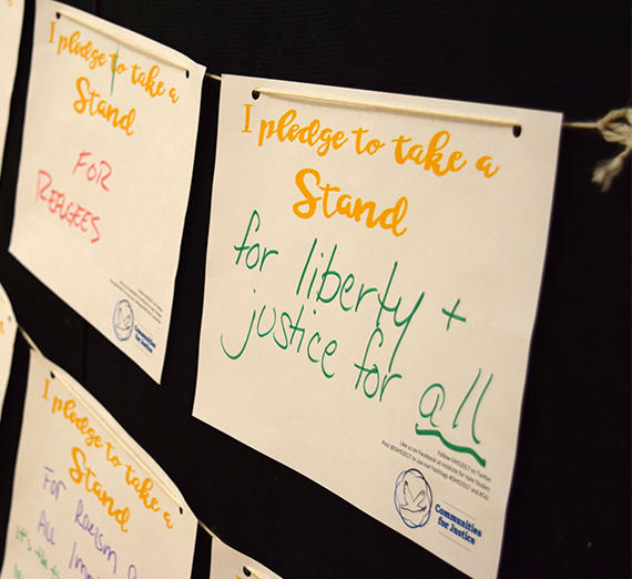 signs with handwritten pledges for justice