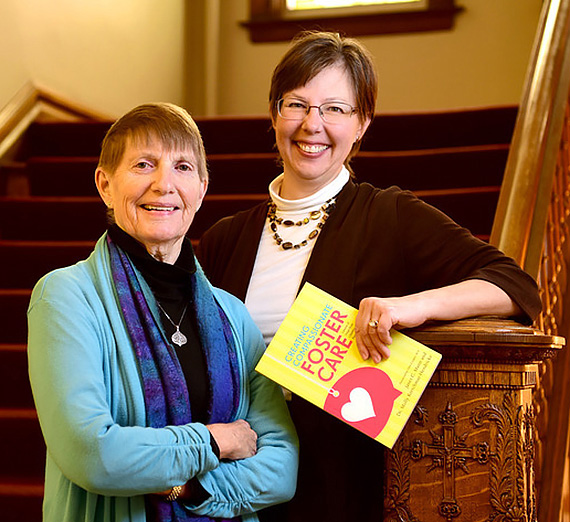 Janet C. Mann and Dr. Molly Kretchmar-Hendricks shown with their new book, Creating Compassionate Foster Care: Lessons of Hope from Children and Families in Crisis.