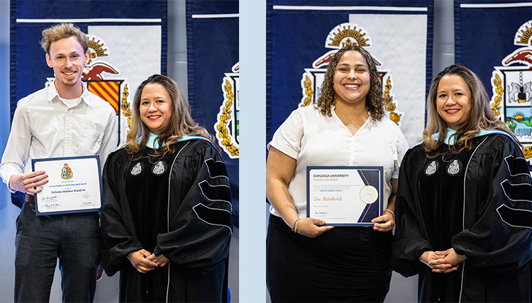 two individuals receive awards from dean