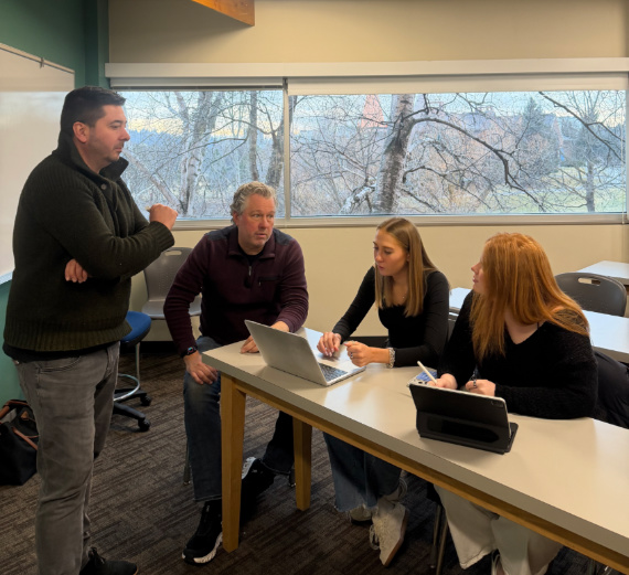 Students talking to Executives in Residence in Classroom
