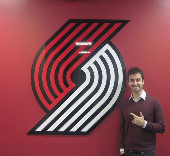 Student Mateo Valdez poses with the Portland Trailblazers' logo