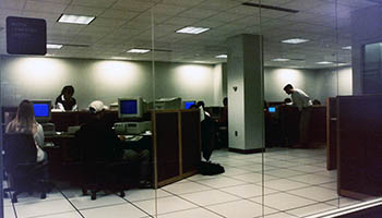 Foley Lower Level Computer lab, a few students are seen in silhouette 