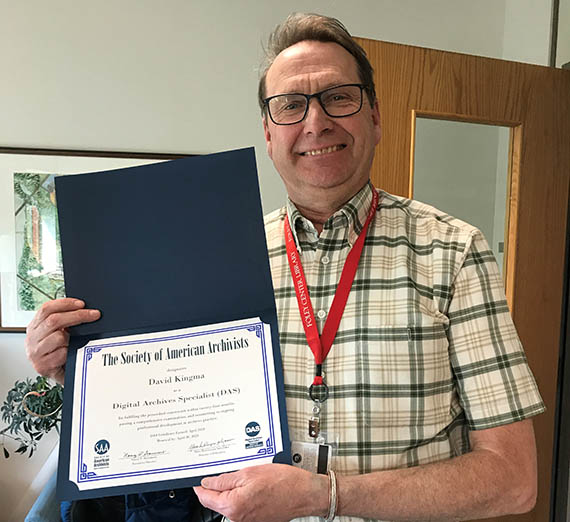 David Kingma holds his Emeritus certificate