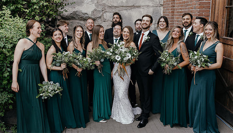 large wedding party in dark green