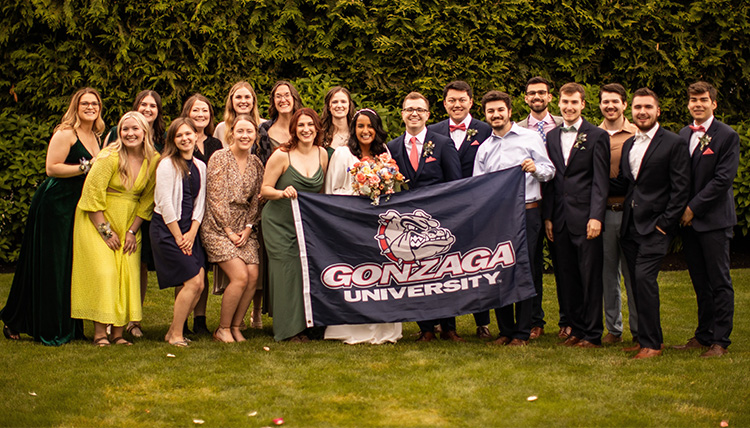 wedding party outdoors with GU flag