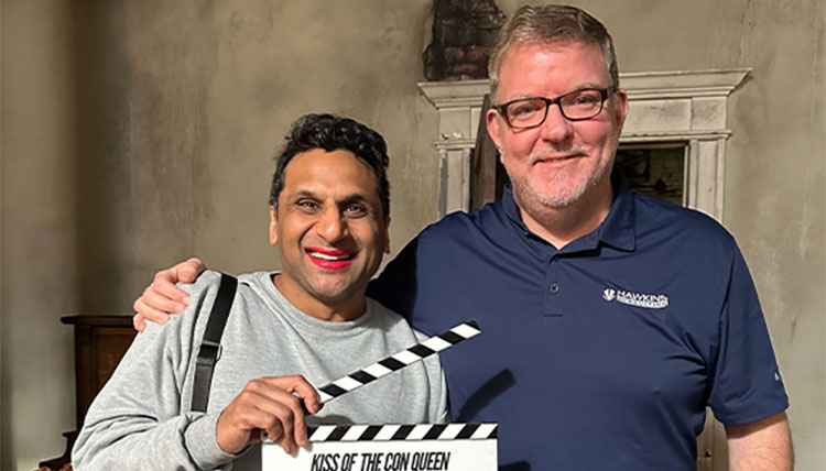 Jeffrey Hawkins pictured on the right with a clapperboard.