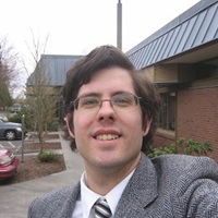 Michael Whitney takes a selfie in front of the Snohomish Country Tribune building.