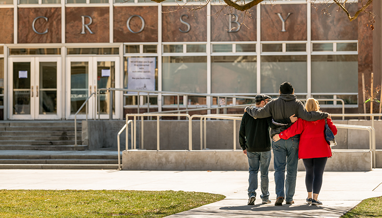 family walking by crosby center