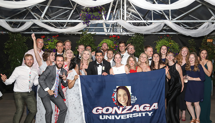large group at wedding with Gonzaga flag