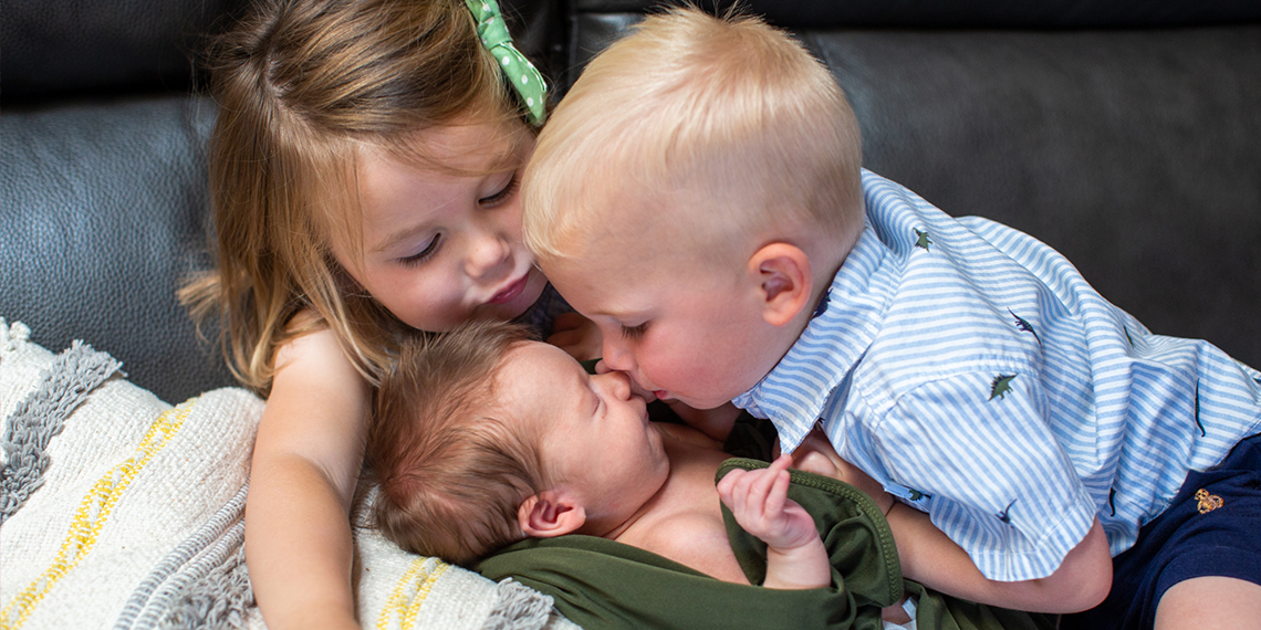 baby with two siblings