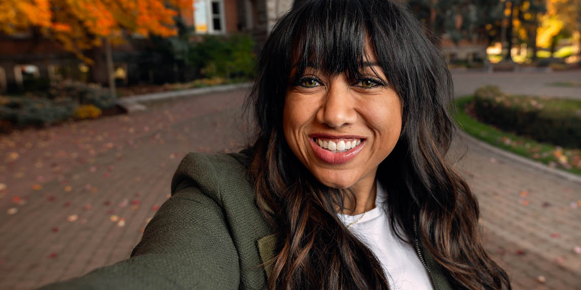 Mandi Price stands in front of College Hall 