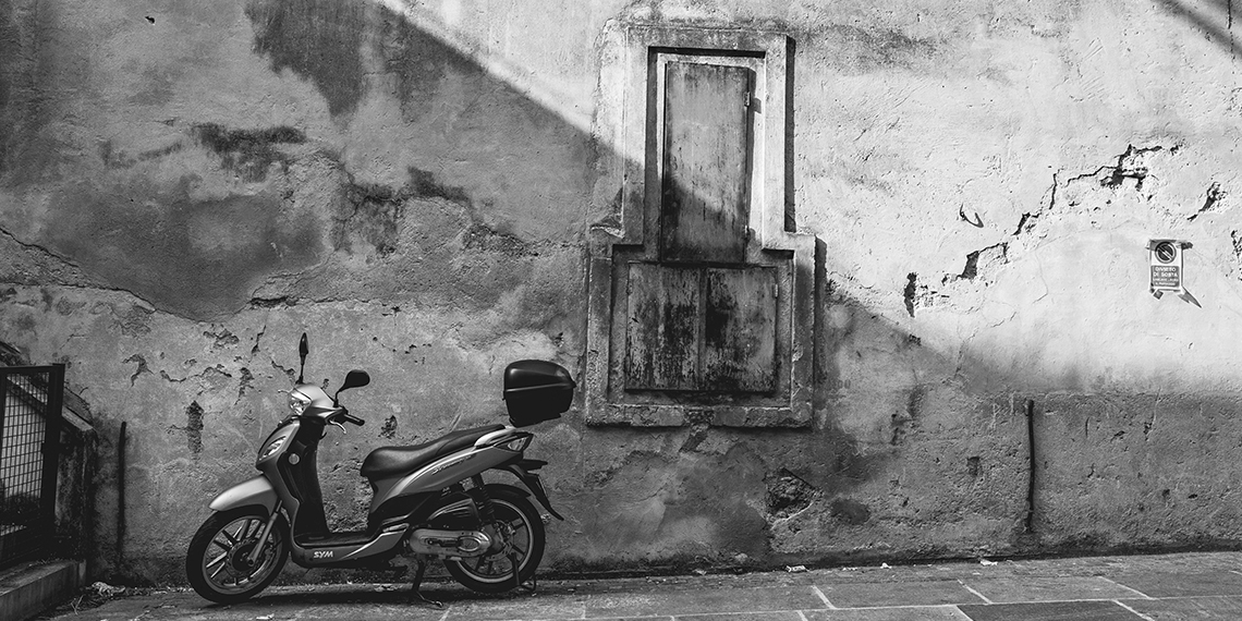 black and white image of motorbike in Italy