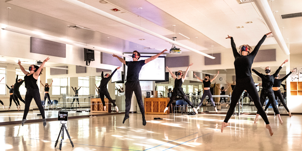 dancers in studio wearing masks