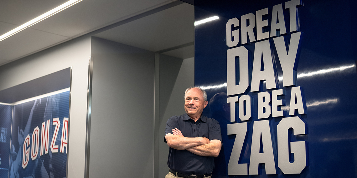 dale in front of sign reading great day to be a zag