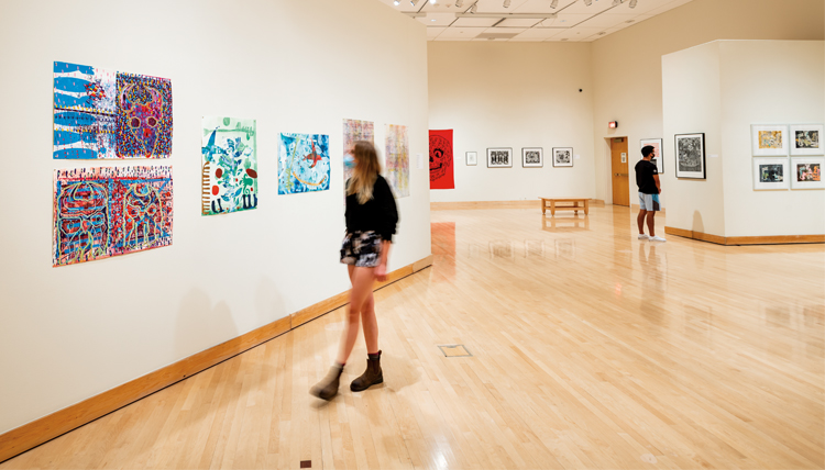 girl walking through exhibit space