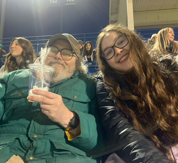 Licon and her GUSR partner, Bruce, enjoying a baseball game.