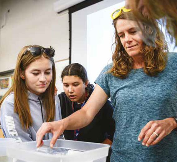 Betsy Bancroft, associate professor of biology and environmental studies, provides hands-on experiences for participants.