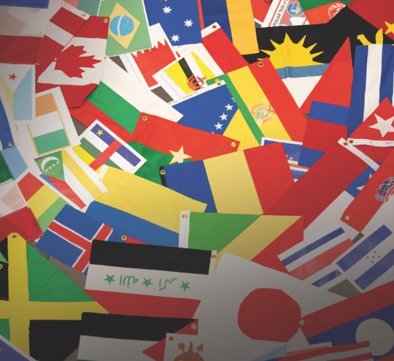 Paper flags of the world lay in a pile 