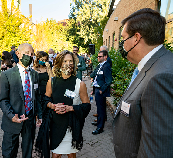 president mcculloh with john and joan bollier outdoors