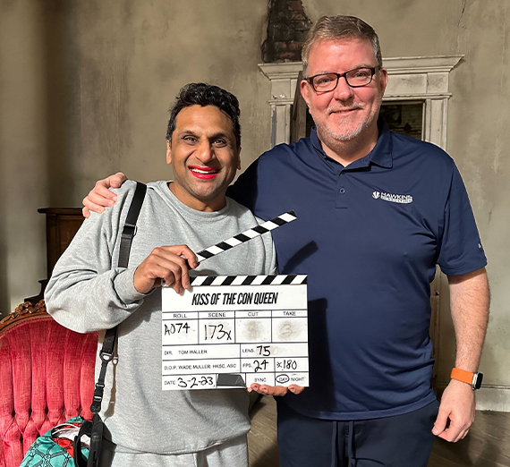 Jeffrey Hawkins pictured on the right with a clapperboard. 