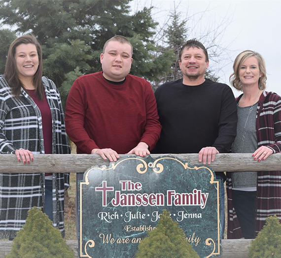 The Janssen Family stands outside their new adult group home. 