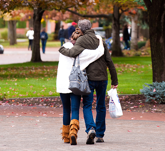 parents hug outdoors